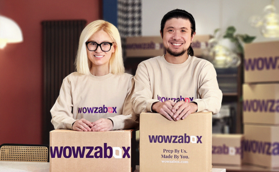 WowzaBox team smile at camera holding WowzaBox food boxes